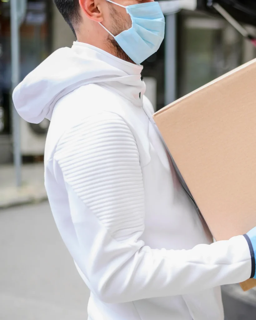 delivery_guy_carrying_cardboard_box_1